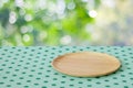 Empty wooden tray on table over blur trees with bokeh background Royalty Free Stock Photo