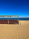 Empty wooden veranda on the sandy beach in Staoueli, Algeria Royalty Free Stock Photo