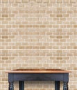 Empty wooden vintage table on brick tiles wall,Mock up for display of product