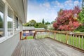 Empty Wooden walkout deck overlooking backyard garden Royalty Free Stock Photo