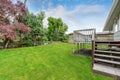 Empty Wooden walkout deck overlooking backyard garden Royalty Free Stock Photo