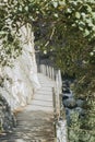 Empty wooden walkway next to the cliffs of the Caminito Del Rey in El Chorro, Spain