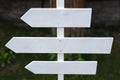 Empty wooden white signs with mockup, pointing direction