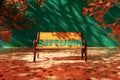 Empty wooden yellow bench with autumn letter and shadows of autumn brown leaves Royalty Free Stock Photo