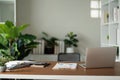 Empty workplace with desk and plant in office room, copy space. work from an atmospheric home office full of green plant Royalty Free Stock Photo