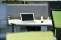 Empty workplace office desk with chair, monitors and laptop in a company due to the coronavirus epidemic Covid-19.