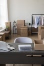 Empty workplace with wrapped product, cardboard container, desktop Royalty Free Stock Photo