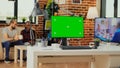 Empty workspace table with greenscreen display on computer Royalty Free Stock Photo