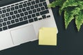 Empty yellow adhesive note on laptop keyboard Royalty Free Stock Photo