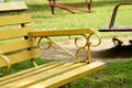 An empty yellow bench in the park. Royalty Free Stock Photo