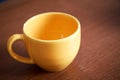 Empty yellow cup of coffee Royalty Free Stock Photo