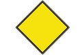 An empty yellow diamond shaped warning sign