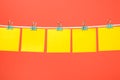 Empty yellow paper notes hanging on the string Royalty Free Stock Photo
