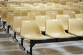 Empty yellow plastic chairs Royalty Free Stock Photo