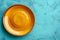 Empty yellow plate on blue background, intermittent fasting concept. Royalty Free Stock Photo