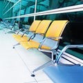 Empty yellow seats at the airport Royalty Free Stock Photo
