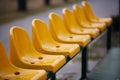 Empty yellow seats on the sport stadium Royalty Free Stock Photo