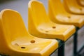 Empty yellow seats on the sport stadium Royalty Free Stock Photo