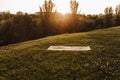 Empty yoga mat at sunset in a park. Ready for yoga exercise concept. Healthy lifestyle Royalty Free Stock Photo