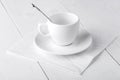 Empy coffee-house cup with spoon and saucer.