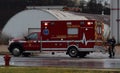 EMT Carrying Bike To Ambulance At Scene Of Accident