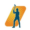 Silhouette of a worker in action pose using his axe tool. Royalty Free Stock Photo