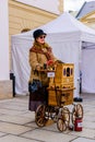 6ena playing the barrel organ at the carnival in Olomouc