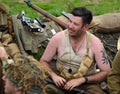 Enactors dressed as British world war two infantry in trench.