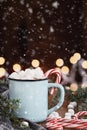 Cocoa with Marshmallows and Candy Canes with Falling Snow Royalty Free Stock Photo