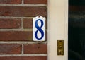 Enameled house number eight 8. Royalty Free Stock Photo