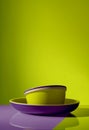 Mockup enamelware on yellow, purple and green background. Ad posters. Minimalistic color enamel objects.