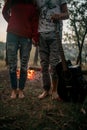 Enamored couple stands with guitar on picnic in forest. Royalty Free Stock Photo