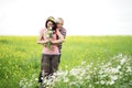 Enamored guy and girl in a green park with white daisies Royalty Free Stock Photo