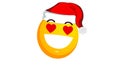 Enamored and smiling yellow emoji ball in santa claus christmas hat isolated on white background. Positive emotions Royalty Free Stock Photo
