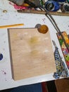 Encaustic painting, also known as hot wax painting, colored pigments, heated beeswax, untreated wood