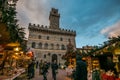 Enchanted atmosphere at the Christmas market in the historic center of Montepulciano with big xmas tree