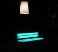 Enchanted forest of light - brightly illuminated bench in the middle of a park Royalty Free Stock Photo