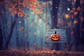 Enchanted Forest Swing with Jack-o-Lantern Amidst Autumn Leaves. Royalty Free Stock Photo