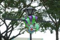 Theme park lamp post with clown face in Santa Rosa, Laguna, Philippines