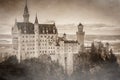 Enchanted view of Neuschwanstein castle with fog in Germany