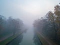 Aerial View: Misty Morning Over Forest Canal in Autumn Royalty Free Stock Photo