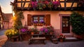 Enchanting Alsatian Wooden House with Vibrant Flower Window Boxes in Alsace, France