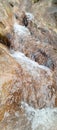 The enchanting beauty of a waterfall on a forest hillside