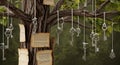 Mystical hanging antique keys with aged parchment scrolls suspended from tree branches, enchanting forest Royalty Free Stock Photo