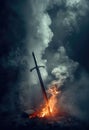 The Prince of Peace\'s Eternal Sword. A flaming sword stuck in the ground. Flames and smoke. Fantasy medieval blade. Royalty Free Stock Photo