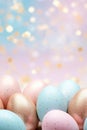 Enchanting Easter background with eggs, bokeh lights and copy space for text. Soft, pastel colors. Tranquil and joyful