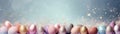 Enchanting Easter background with eggs, glitter, bokeh lights and copy space for text. Pastel colors. Tranquil and