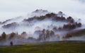 Foggy morning on the hill in the Italian countryside. Autumn landscape. Royalty Free Stock Photo