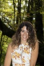 Enchanting Forest Escape: A Radiant Brown-Haired Woman in Rustic Attire