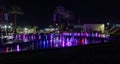 Enchanting grandiose musical performance - water and light show of a musical fountain on the embankment, in the center of the city